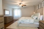 Master bedroom suite w/ king size bed and private backyard access